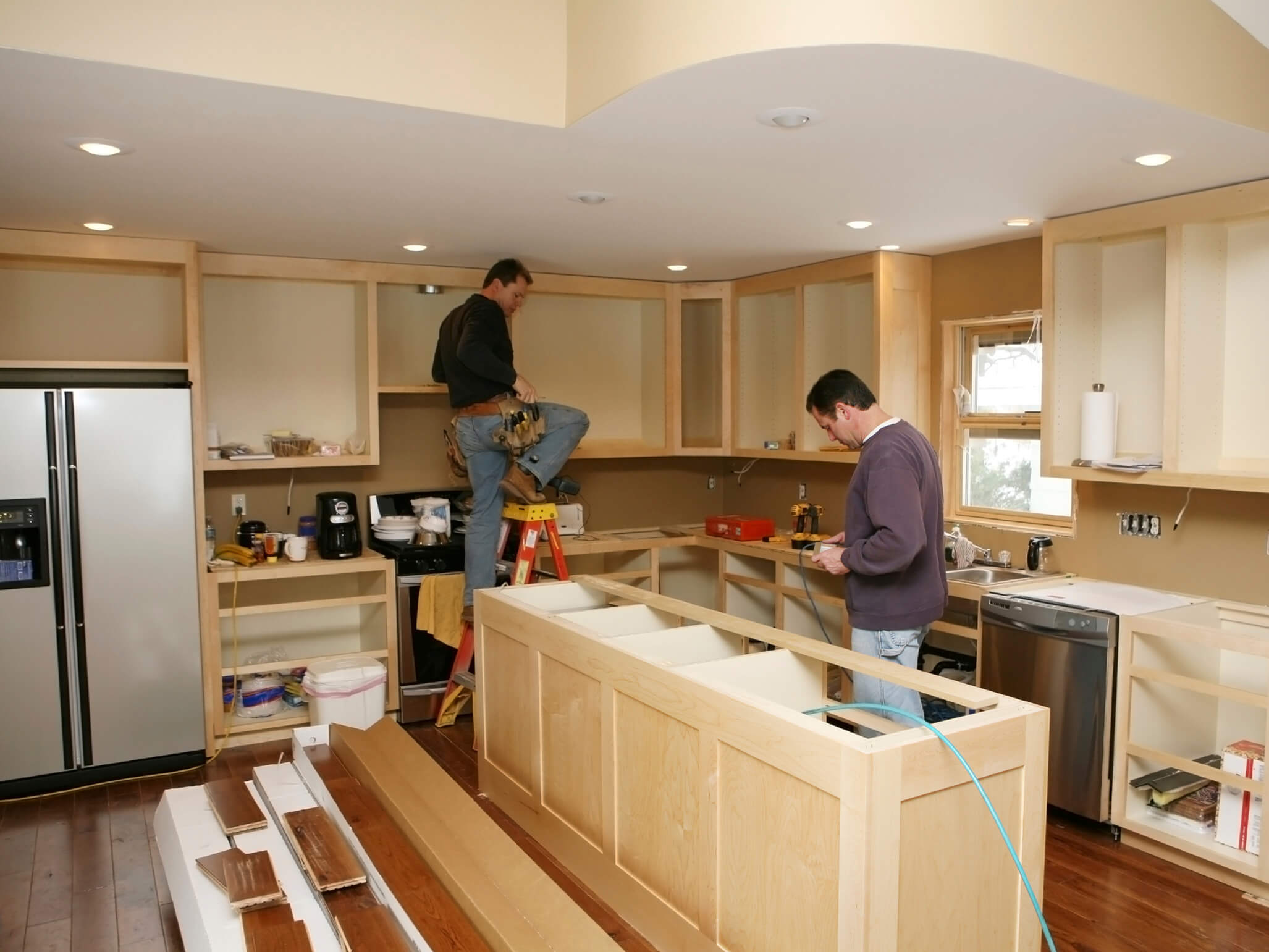 Texas home with contractors renovating kitchen